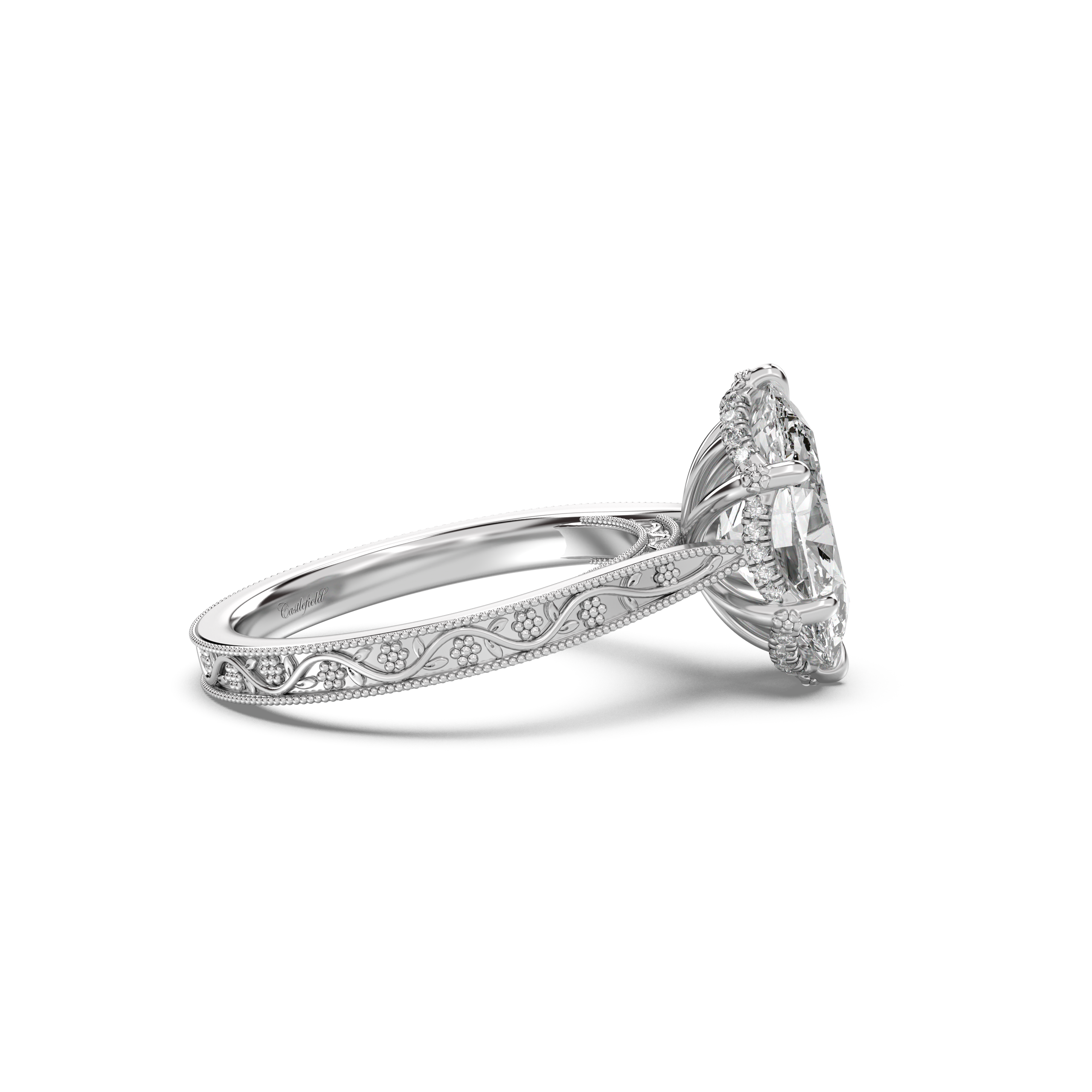 Oval white gold engagement ring with floral engraved band by castlefield collection