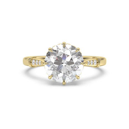 An antique style yellow gold engagement ring with antique round diamond and tiny heart details