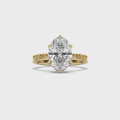 Oval yellow gold engagement ring with floral engraved band by castlefield collection