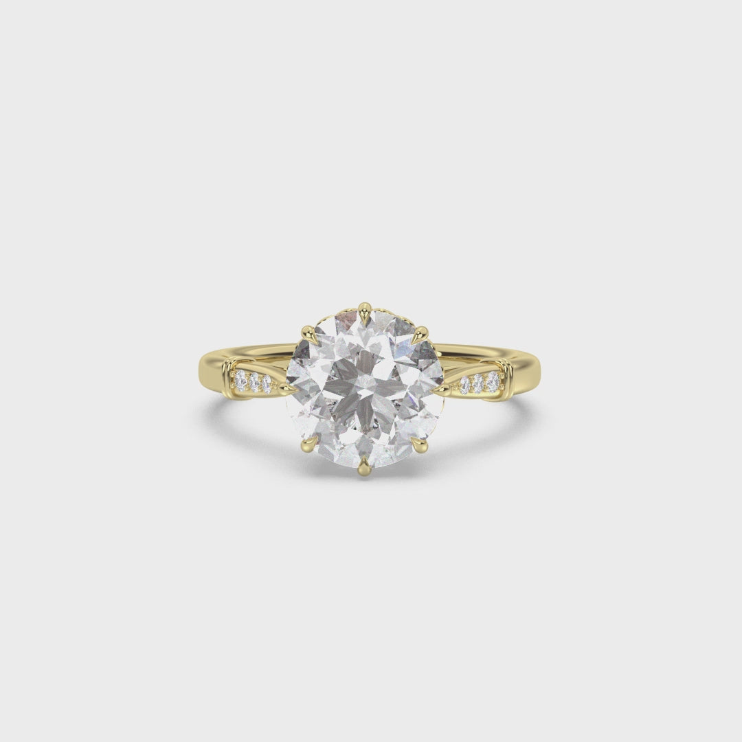 Video of an antique style yellow gold engagement ring with tiny heart details