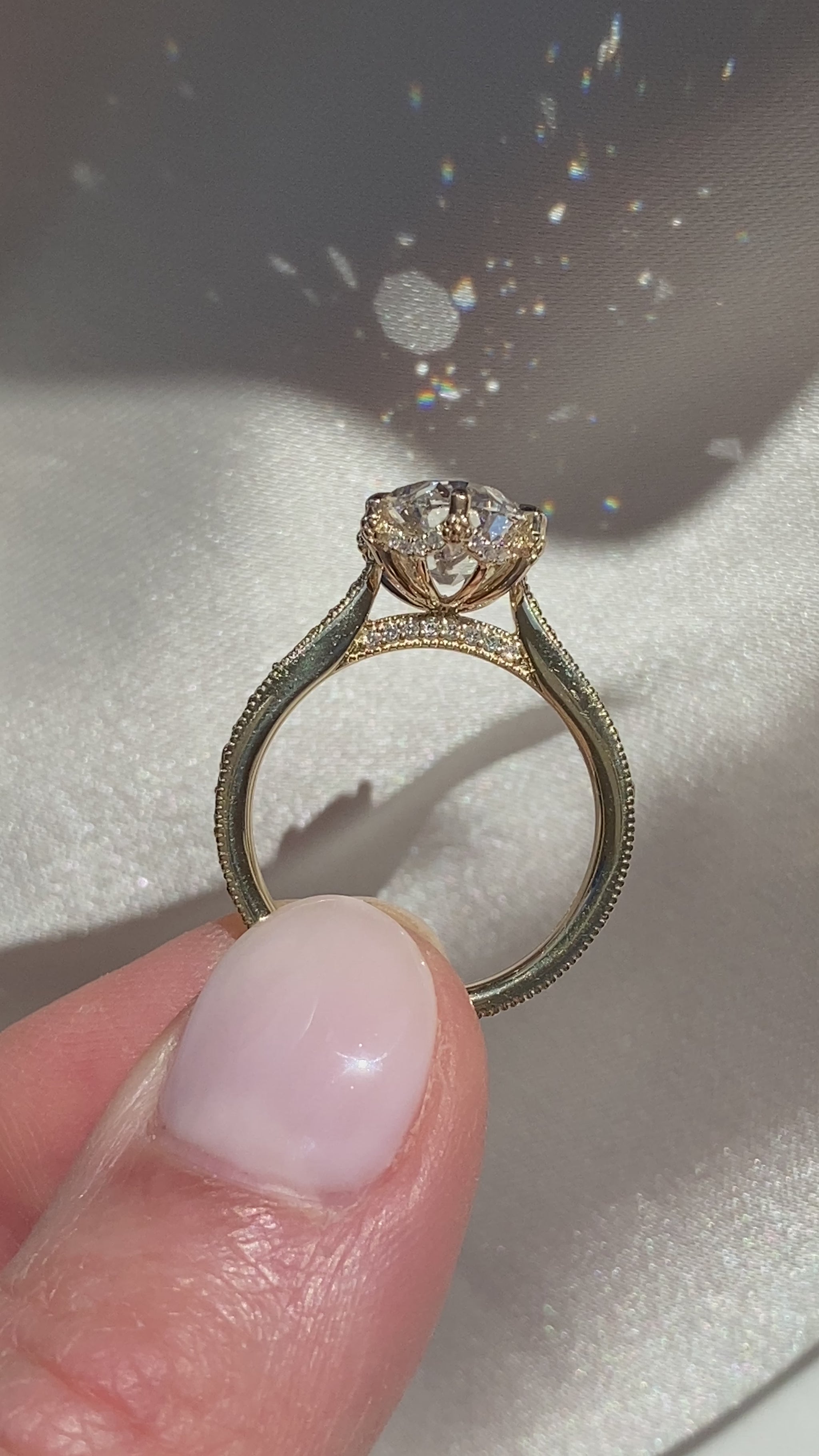 Oval yellow gold engagement ring with floral engraved band by castlefield collection